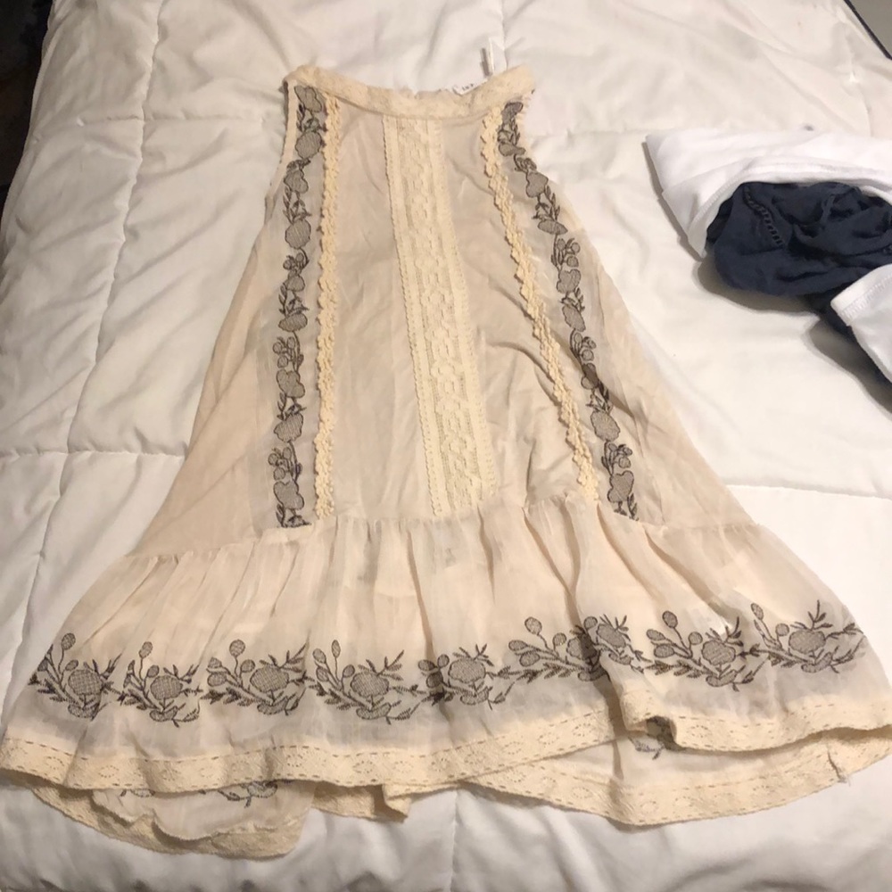High neck tan shirt with lace and floral detail